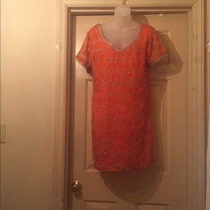 Orange tunic.